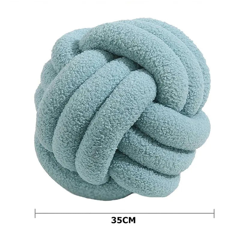 Coussin boule nouée – Douceur décorative et unique
