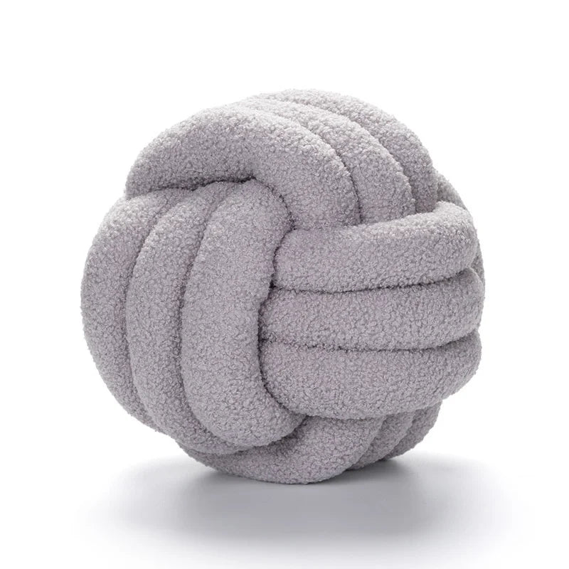 Coussin boule nouée – Douceur décorative et unique